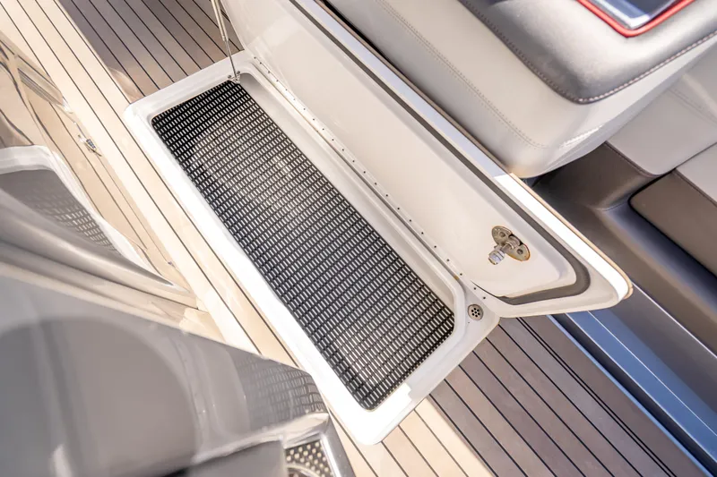Slide: The Image of Open storage compartment on 2022 Nor-Tech 500 Sport Center Console boat deck. - 67