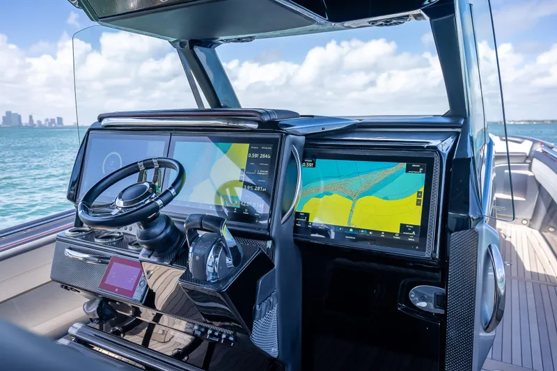 Slide: The Image of 2022 Nor-Tech 500 Sport Center Console helm with advanced navigation displays. - 7