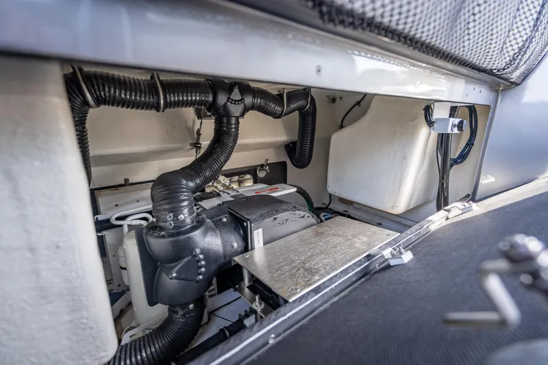 Slide: The Image of Engine compartment of 2022 Nor-Tech 500 Sport Center Console boat, showcasing mechanical components. - 71