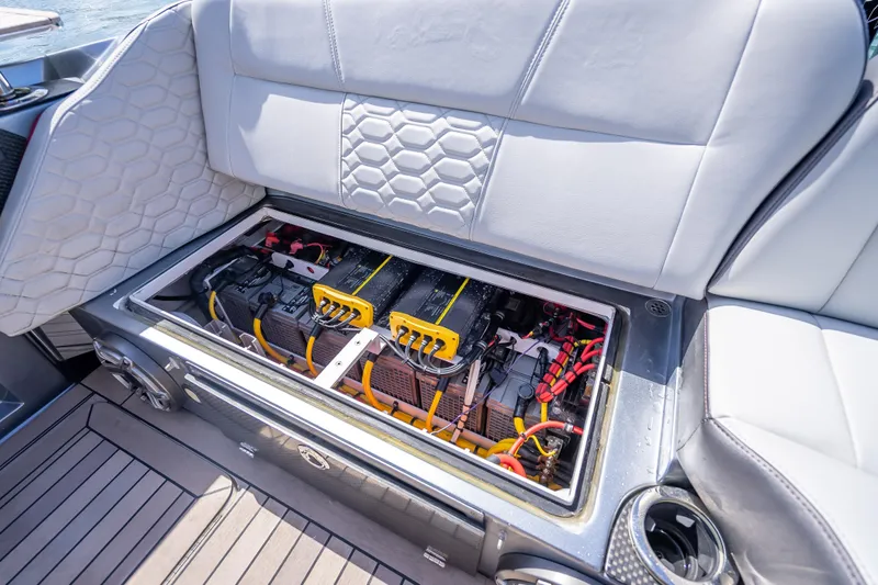 Slide: The Image of 2022 Nor-Tech 500 Sport Center Console battery compartment with advanced wiring and connections. - 72