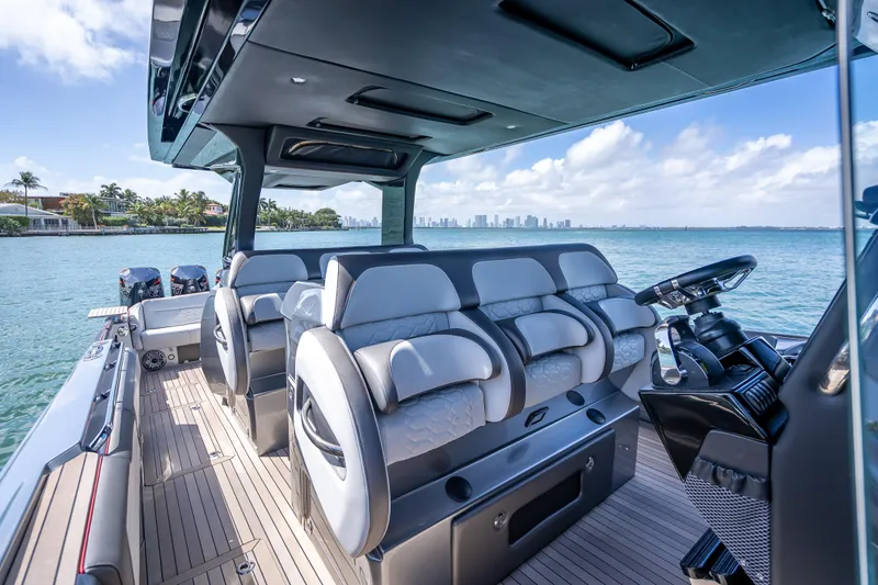 Slide: The Image of 2022 Nor-Tech 500 Sport Center Console boat interior with luxurious seating and ocean view. - 76