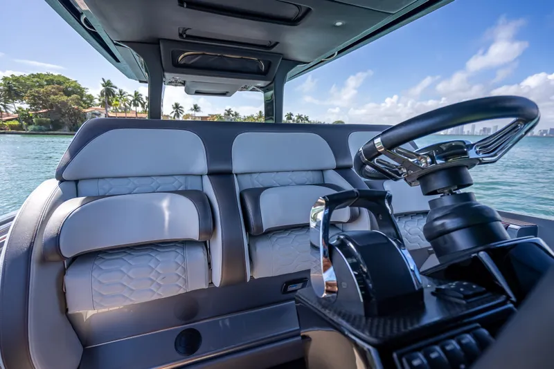 Slide: The Image of 2022 Nor-Tech 500 Sport Center Console interior with luxurious seating and steering wheel. - 77