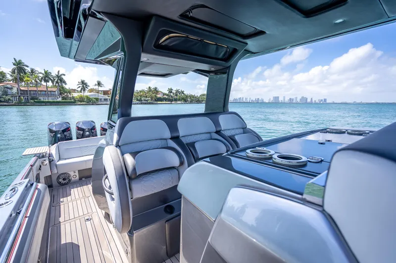 Slide: The Image of 2022 Nor-Tech 500 Sport Center Console boat interior with luxurious seating and ocean view. - 79