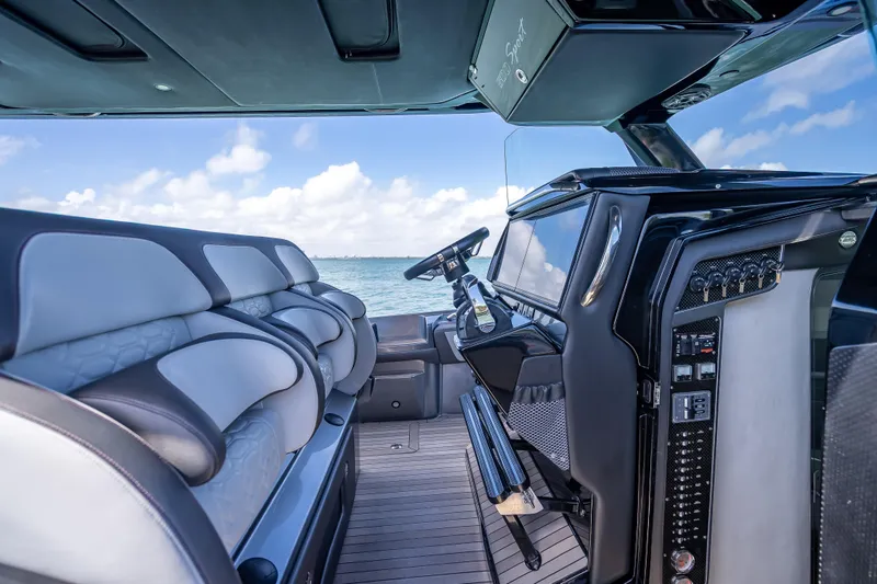 Slide: The Image of 2022 Nor-Tech 500 Sport Center Console interior with luxurious seating and advanced controls. - 80