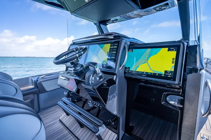 Slide: The Image of 2022 Nor-Tech 500 Sport Center Console cockpit with advanced navigation displays. - 81