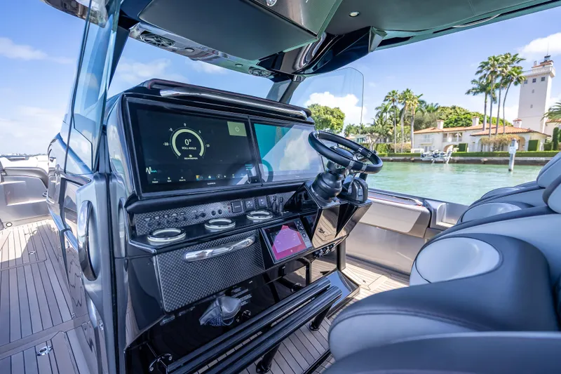 Slide: The Image of 2022 Nor-Tech 500 Sport Center Console cockpit with advanced navigation system and luxurious seating. - 82