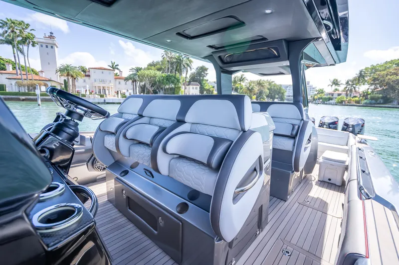 Slide: The Image of 2022 Nor-Tech 500 Sport Center Console interior with luxurious seating and modern design. - 84