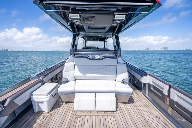 Slide: The Image of 2022 Nor-Tech 500 Sport Center Console on water, featuring luxurious seating and sleek design. - 9