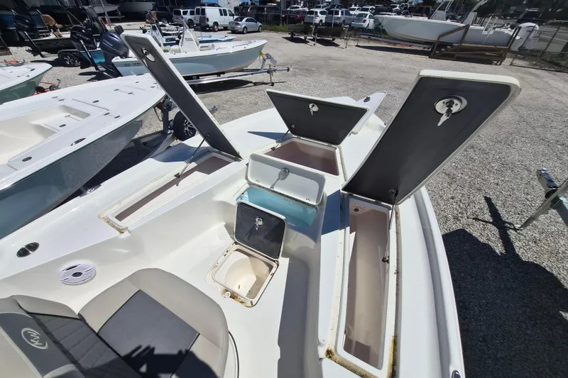 Slide: The Image of 2026 Key West 230 Bay Reef boat interior with seating and console. - 10