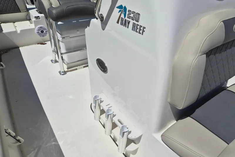 Slide: The Image of 2026 Key West 230 Bay Reef boat console with steering wheel and seating. - 12