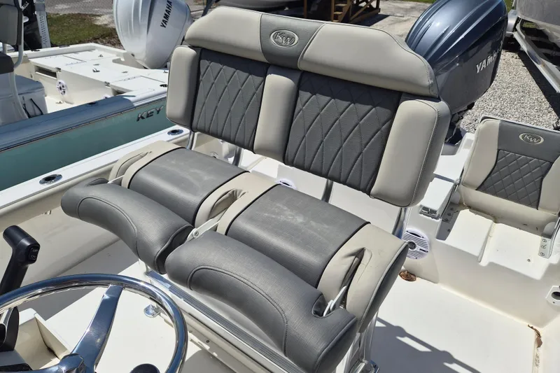 Slide: The Image of Steering console of 2026 Key West 230 Bay Reef boat with controls and gauges. - 6