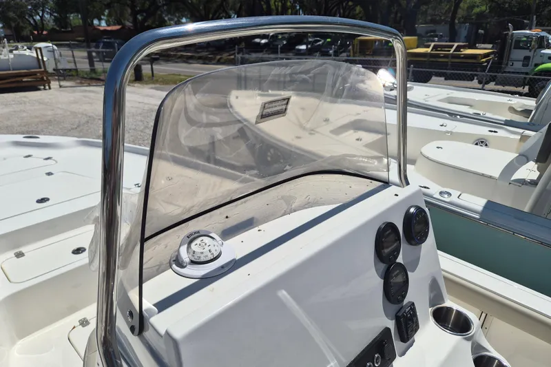 Slide: The Image of 2026 Key West 230 Bay Reef boat deck with storage compartments and seating. - 8