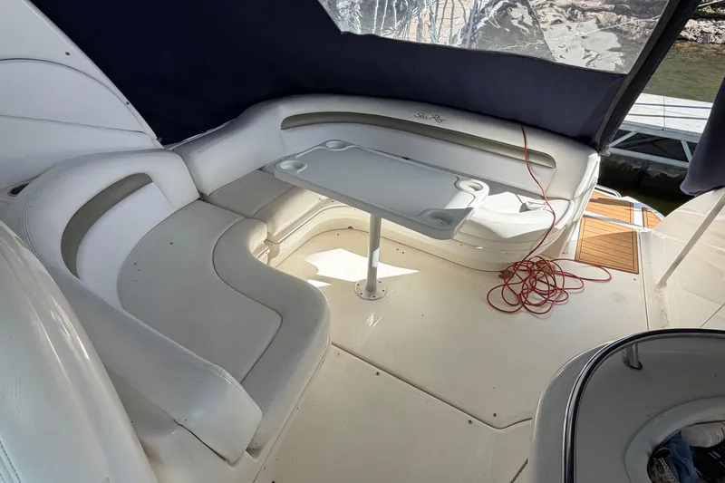 Slide: The Image of 2006 Sea Ray 340 Sundancer boat interior with seating and table. - 13