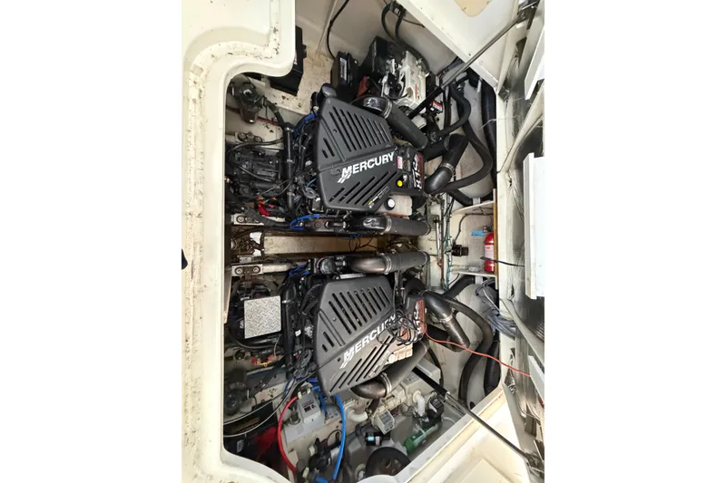 Slide: The Image of Engine compartment of a 2006 Sea Ray 340 Sundancer with twin Mercury engines. - 25