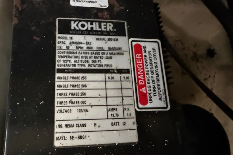 Slide: The Image of Kohler generator label on 2006 Sea Ray 340 Sundancer, showing specifications and safety warning. - 26