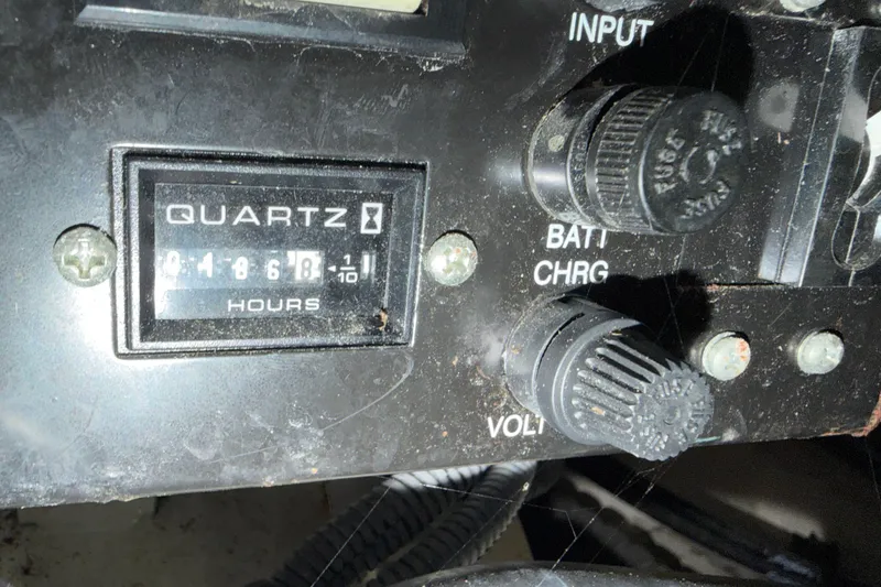 Slide: The Image of Control panel of a 2006 Sea Ray 340 Sundancer with hour meter and knobs. - 27