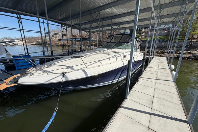 Slide: The Image of 2006 Sea Ray 340 Sundancer docked under a covered marina. - 8