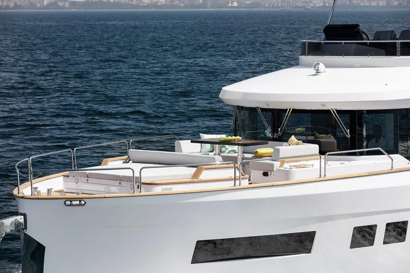 Slide: The Image of Luxurious 2026 Sirena 68 yacht cruising on open water, featuring elegant deck seating. - 10