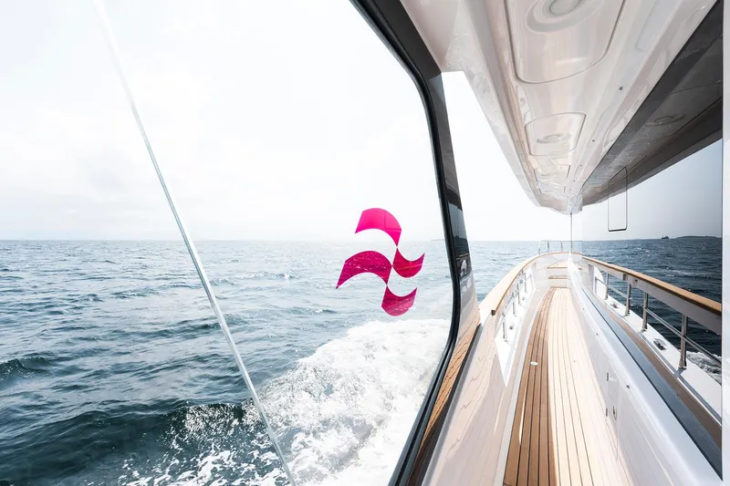 Slide: The Image of Luxurious Sirena 68 yacht cruising on open sea, showcasing sleek design, 2026 model. - 17