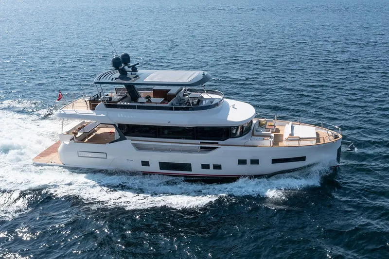 Slide: The Image of Luxurious 2026 Sirena 68 yacht cruising on open sea, showcasing sleek design and elegance. - 2