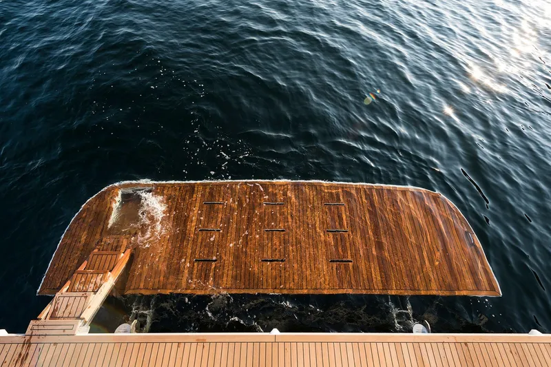 Slide: The Image of Sleek Sirena 68 yacht platform on water, 2026 model, showcasing luxury design. - 22