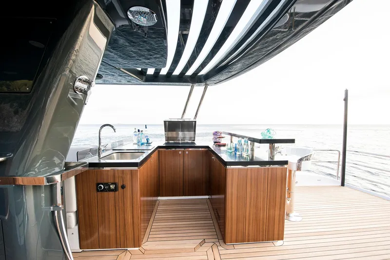 Slide: The Image of Luxurious outdoor kitchen on 2026 Sirena 68 yacht with ocean view. - 27
