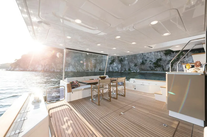 Slide: The Image of Luxurious Sirena 68 yacht deck, 2026 model, with elegant seating and scenic ocean view. - 30