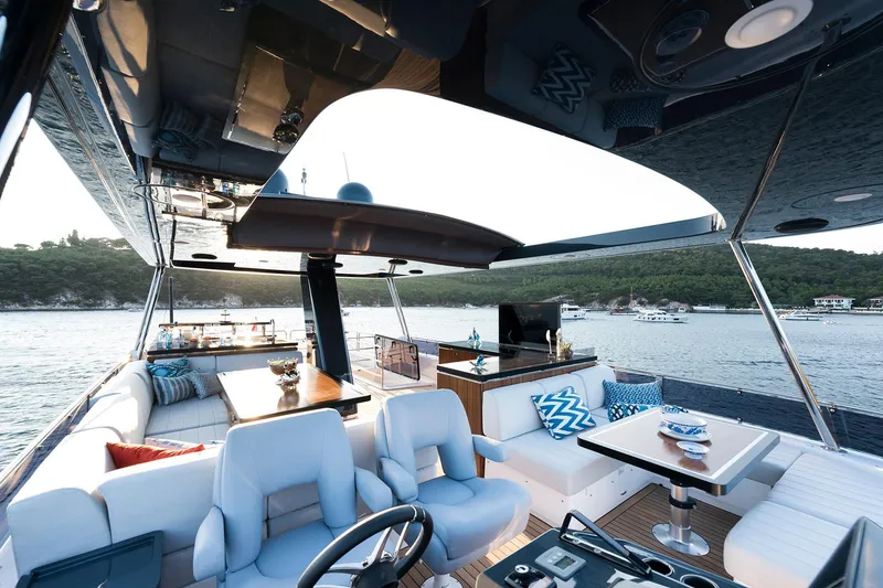 Slide: The Image of Luxurious 2026 Sirena 68 yacht interior with elegant seating and scenic ocean view. - 33