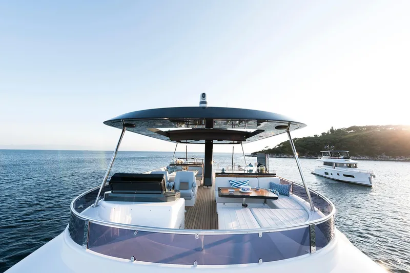 Slide: The Image of Luxurious 2026 Sirena 68 yacht on serene waters, featuring spacious deck and elegant design. - 35