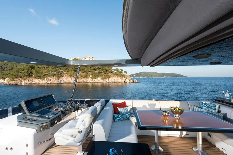 Slide: The Image of Luxurious 2026 Sirena 68 yacht deck with ocean view and elegant seating area. - 37