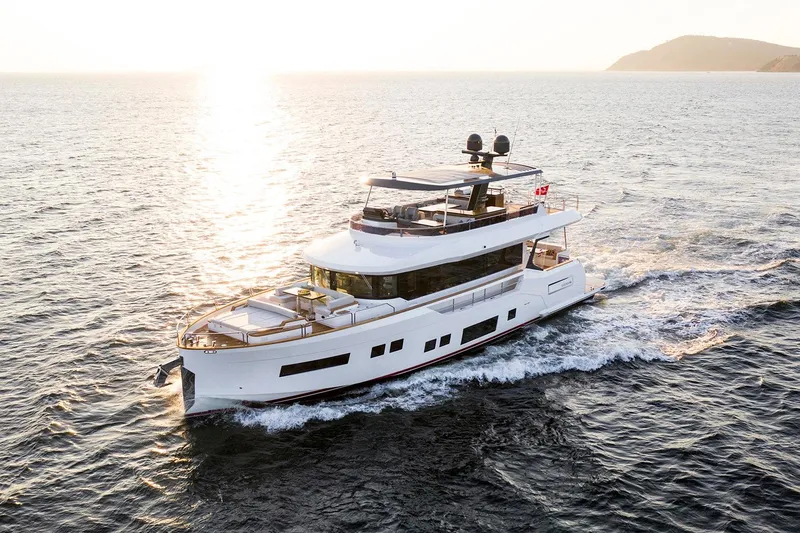 Slide: The Image of Luxurious 2026 Sirena 68 yacht cruising at sunset on open water. - 4