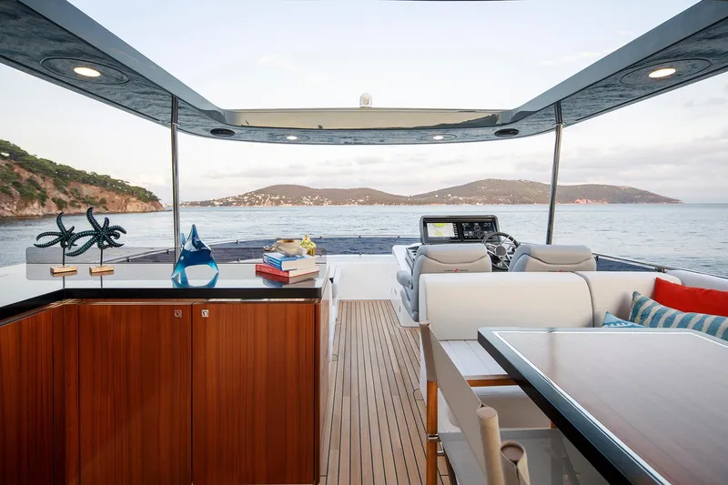 Slide: The Image of Luxurious 2026 Sirena 68 yacht interior with ocean view, featuring elegant seating and decor. - 41
