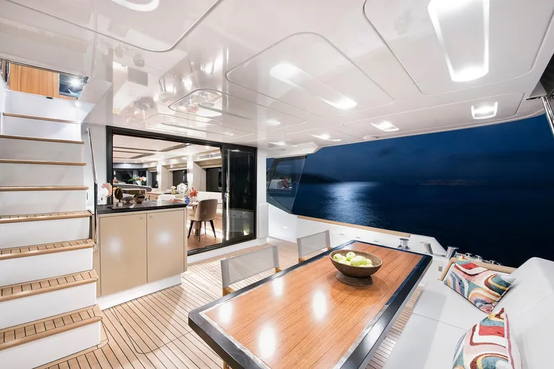 Slide: The Image of Luxurious interior of 2026 Sirena 68 yacht with elegant dining area and ocean view. - 42