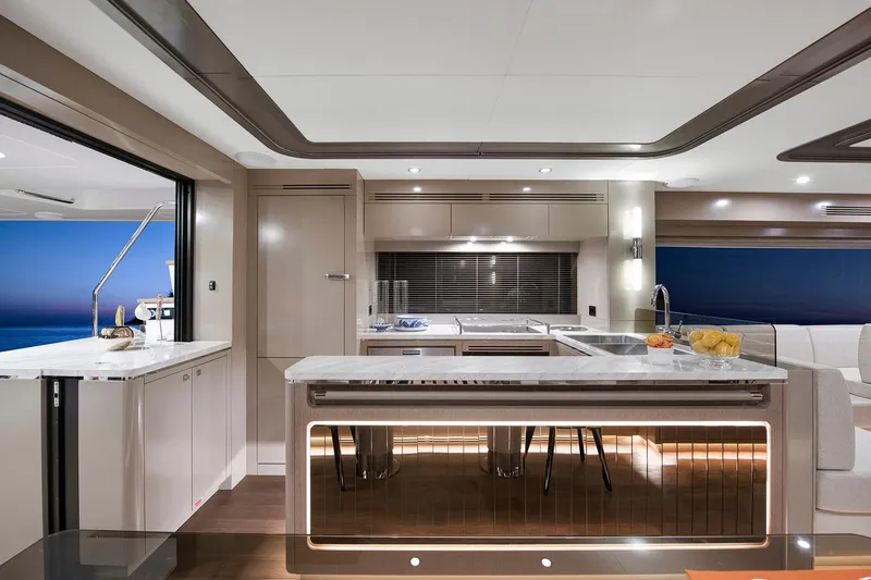 Slide: The Image of Luxurious interior of 2026 Sirena 68 yacht featuring modern kitchen design and elegant finishes. - 54