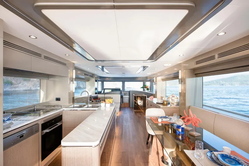 Slide: The Image of Luxurious interior of 2026 Sirena 68 yacht with modern kitchen and dining area. - 56