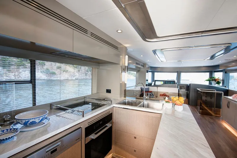Slide: The Image of Luxurious interior of 2026 Sirena 68 yacht with modern kitchen and panoramic windows. - 57