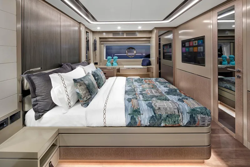Slide: The Image of Luxurious Sirena 68 yacht bedroom interior, featuring elegant bedding and modern design, 2026 model. - 59