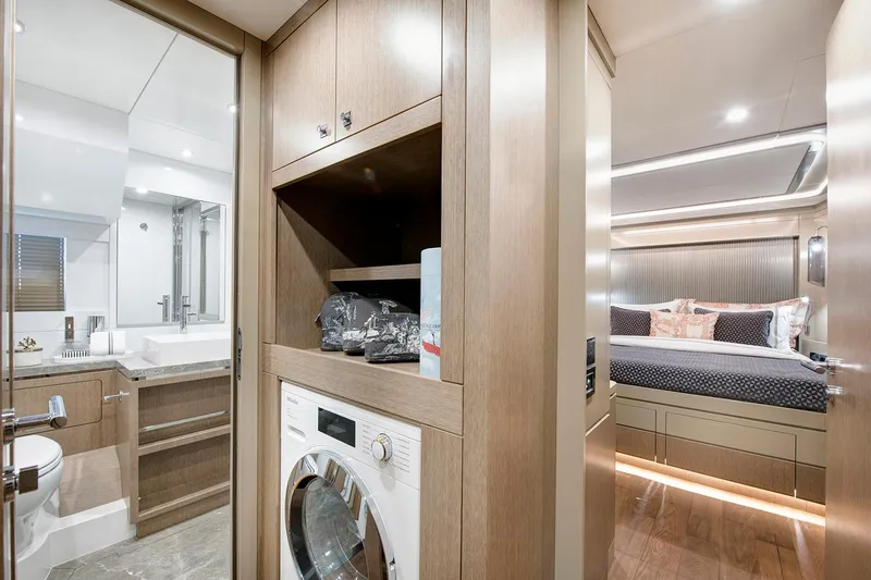 Slide: The Image of Luxurious Sirena 68 yacht interior featuring a modern bathroom, laundry area, and cozy bedroom. - 62