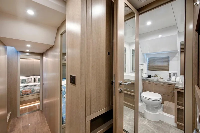 Slide: The Image of Luxurious interior of 2026 Sirena 68 yacht featuring modern bathroom and cozy bedroom. - 63