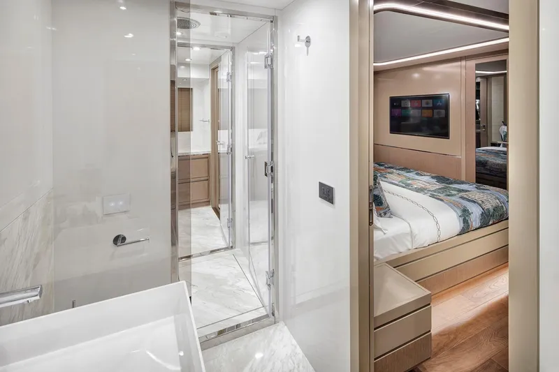 Slide: The Image of Luxurious interior of 2026 Sirena 68 yacht featuring modern bathroom and cozy bedroom. - 65