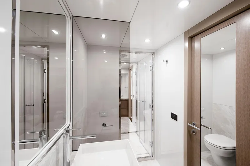 Slide: The Image of Luxurious bathroom interior on 2026 Sirena 68 yacht, featuring modern fixtures and elegant design. - 67