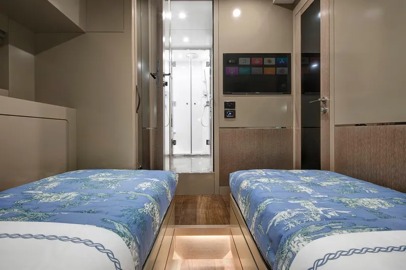 Slide: The Image of Interior of 2026 Sirena 68 yacht cabin with twin beds and modern decor. - 74