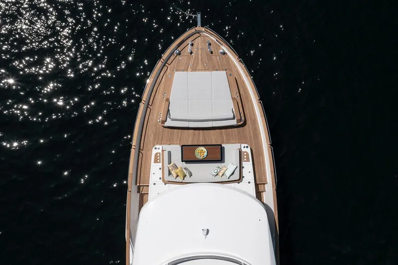 Slide: The Image of Aerial view of 2026 Sirena 68 yacht deck with sun loungers and table. - 9