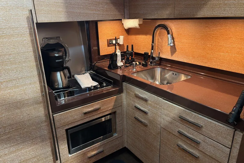 Slide: The Image of Compact kitchen in 2008 Azimut 47 yacht with sink, stove, and appliances. - 16