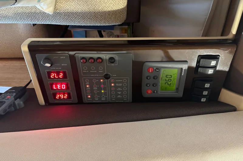 Slide: The Image of Control panel of a 2008 Azimut 47 yacht, featuring digital displays and switches. - 19