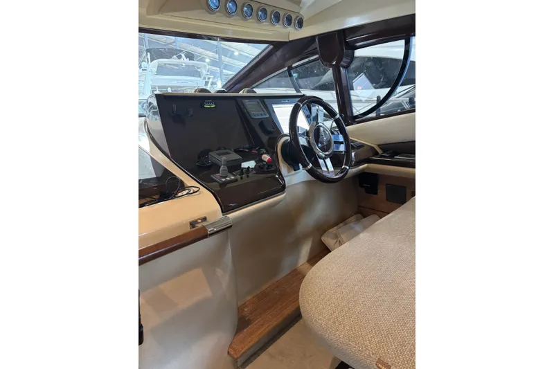 Slide: The Image of Interior helm of 2008 Azimut 47 yacht with steering wheel and control panel. - 20