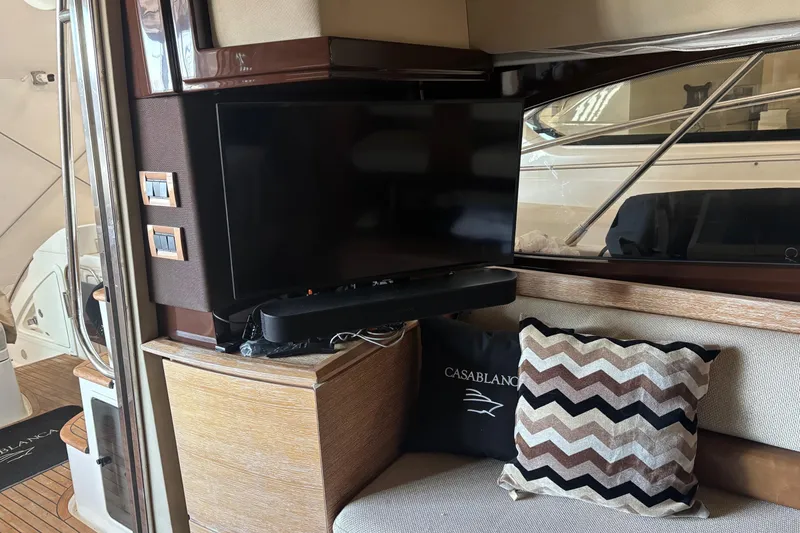Slide: The Image of Interior of 2008 Azimut 47 yacht with TV, soundbar, and decorative pillows. - 21