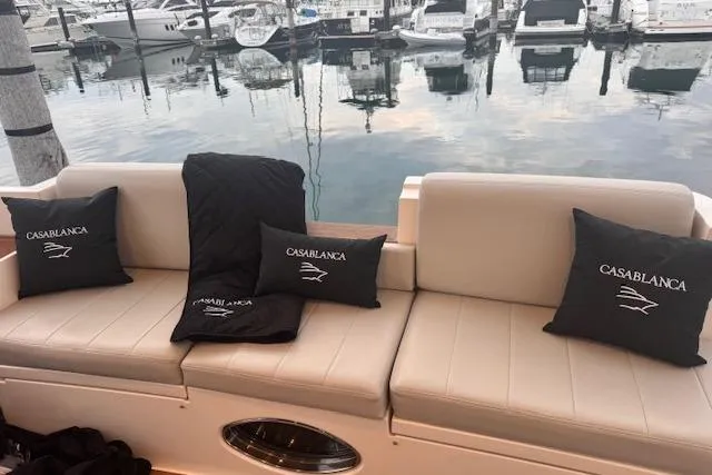 Slide: The Image of Luxurious seating on a 2008 Azimut 47 yacht with "Casablanca" pillows at a marina. - 3