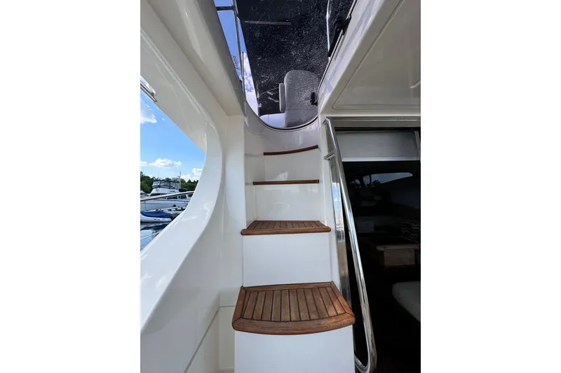 Slide: The Image of Staircase on 2008 Azimut 47 yacht with wooden steps and sleek design. - 30