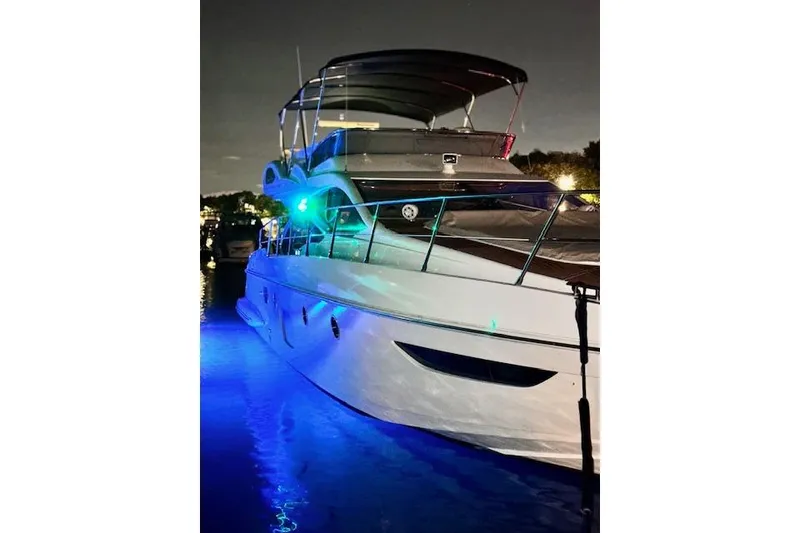 Slide: The Image of 2008 Azimut 47 yacht illuminated at night with blue underwater lights. - 6